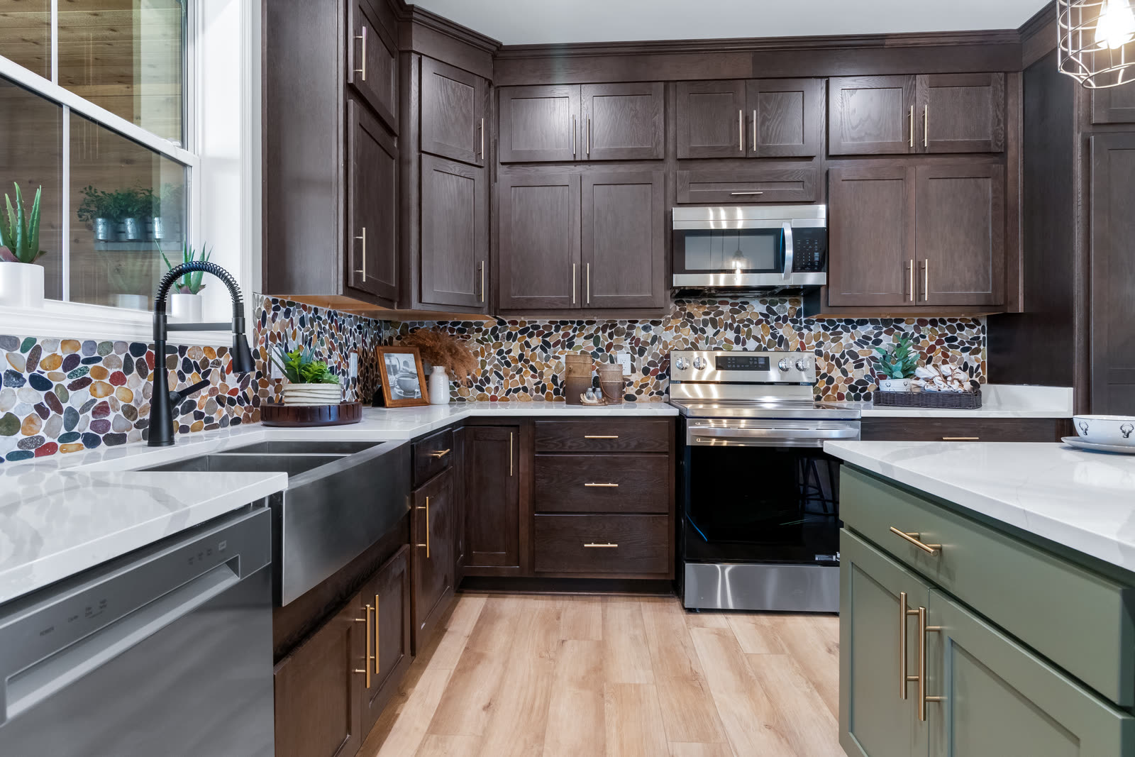 Dark wood kitchen with a farmhouse sink and mosaic backsplash
